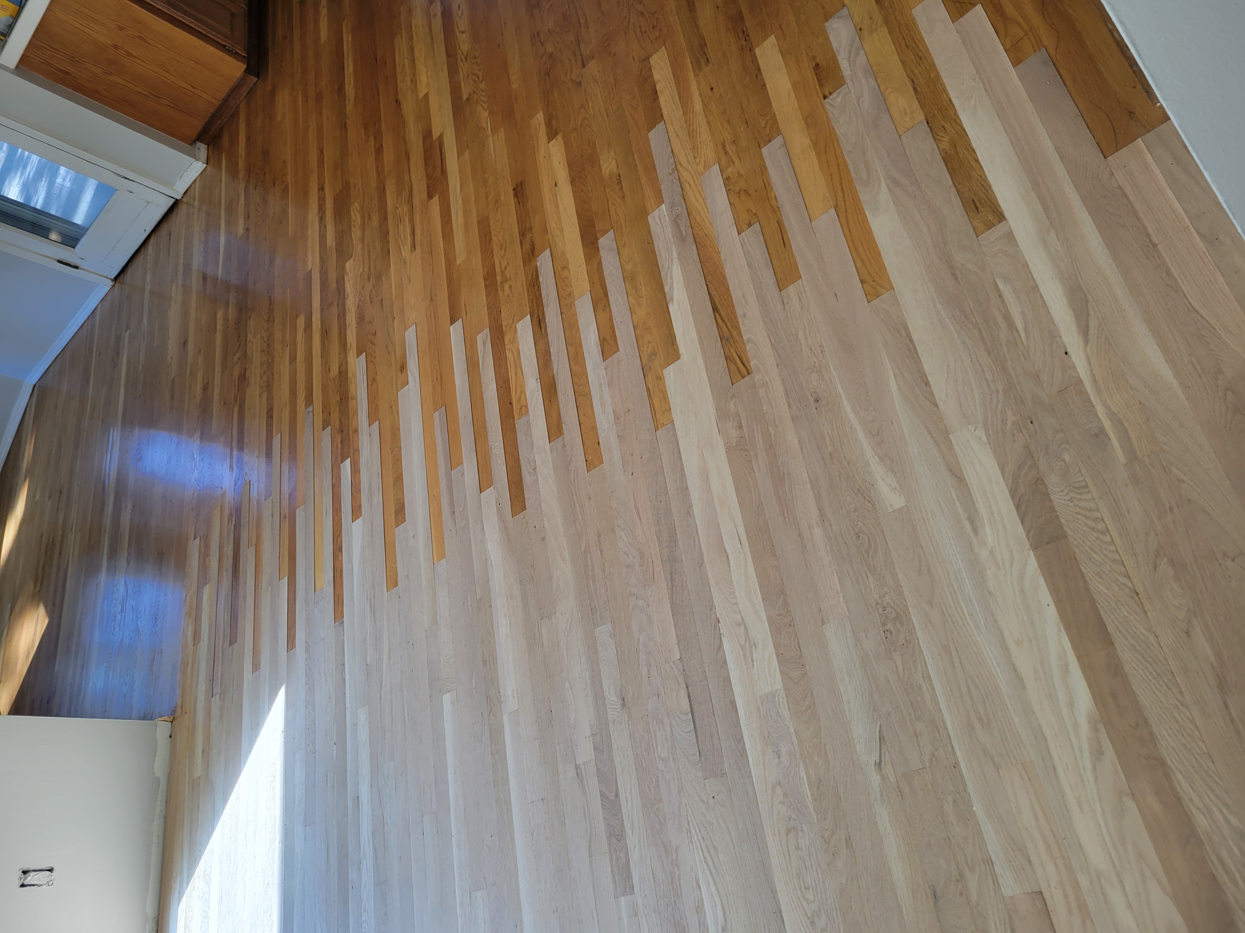 New red oak 2-1/4 x 3/4 flooring weaved into the existing red oak floor