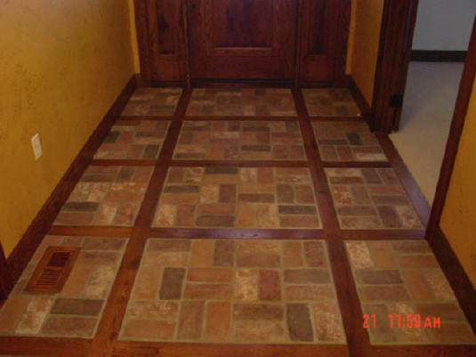 Finished tile and hardwood inlay.